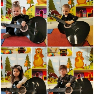 Dzieci z grupy Biedronki poznają różne instrumenty muzyczne 
